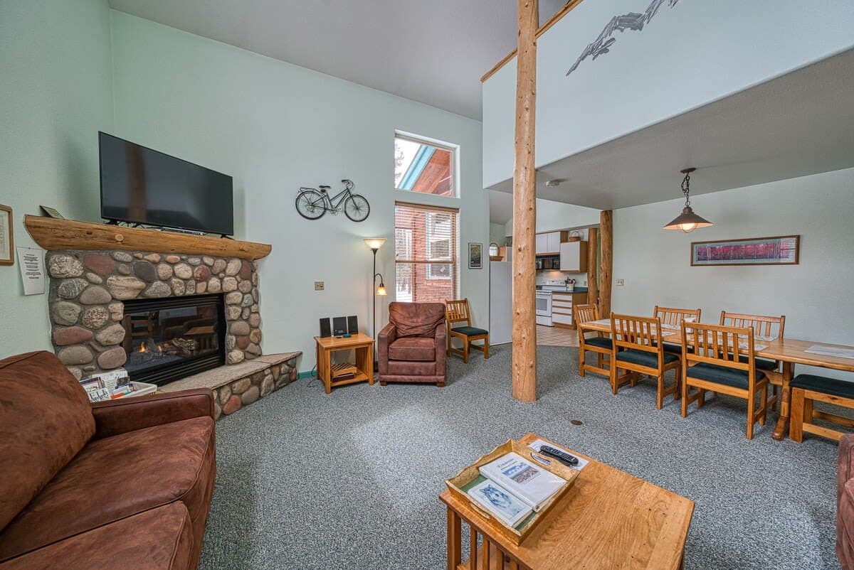 【Living Room】Gas fireplace and sectional with smart TV — the after-trail landing zone for 8 guests.
