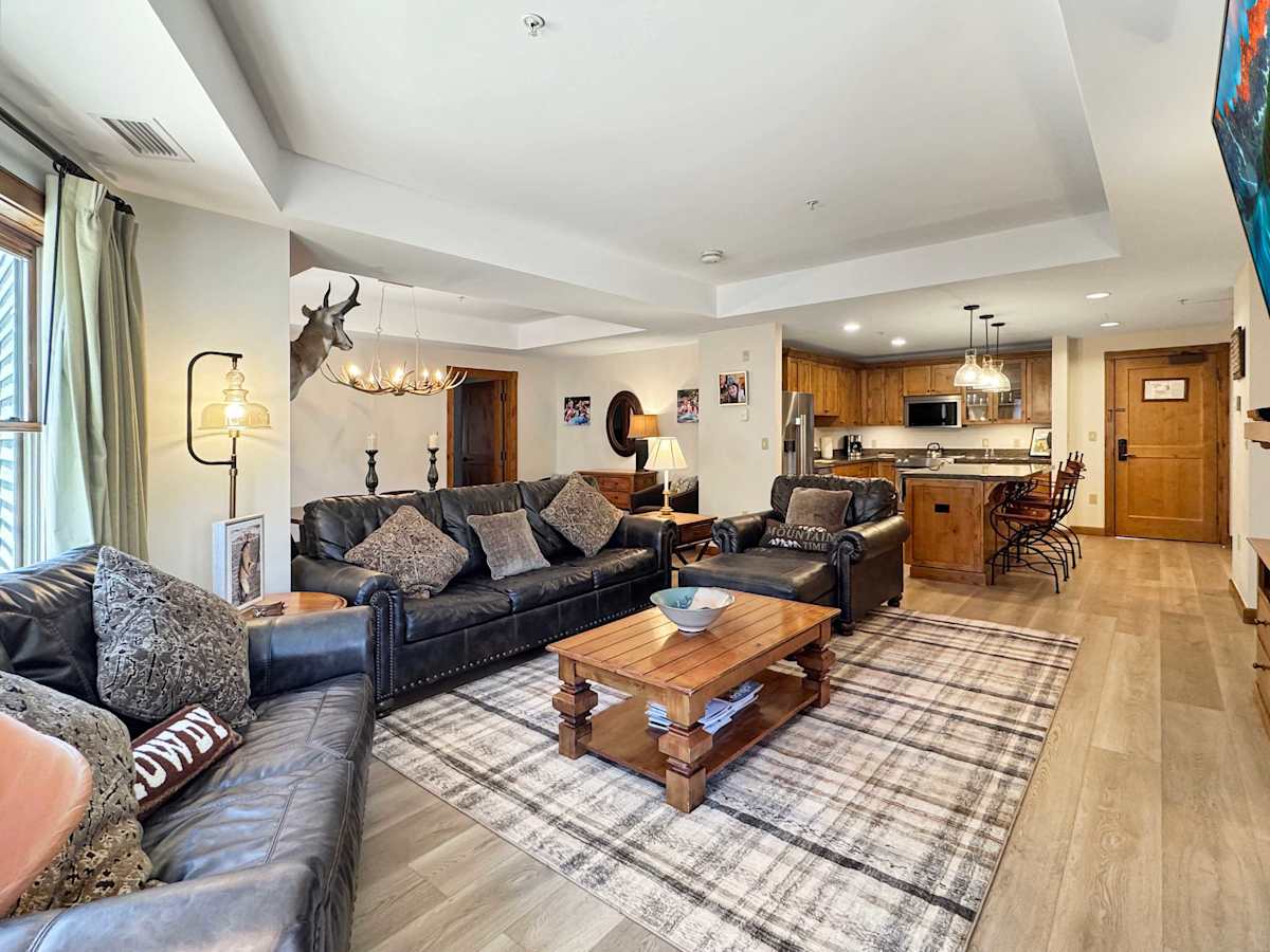 Room for the whole family to relax around a fireplace | Listed with @BookTraverse
