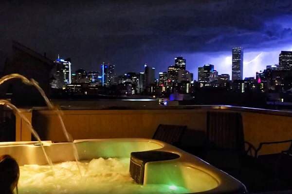 【Rooftop】 Summer storms roll in from the east — you watch from the water