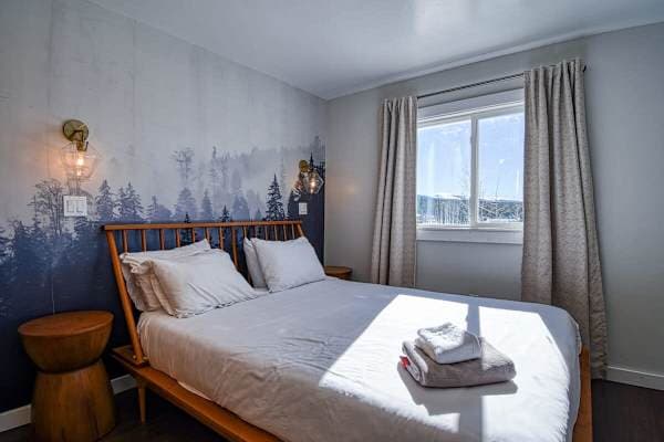 【Bedroom 1】 King bed, smart TV, forest mural — sleep deep at 10,000 ft
