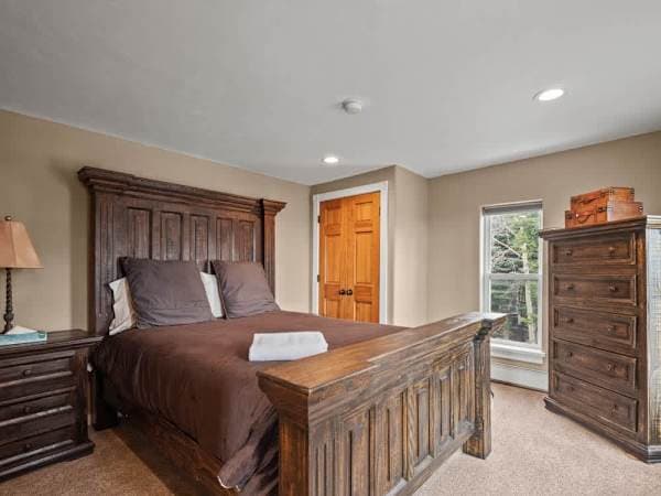 【Bedroom 1】 Queen bed — one of three queens upstairs, one per couple.