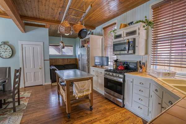 【Kitchen】Fully updated cabinets, dishwasher, full-size fridge — coffee station ready for 12 by 6 a.m.