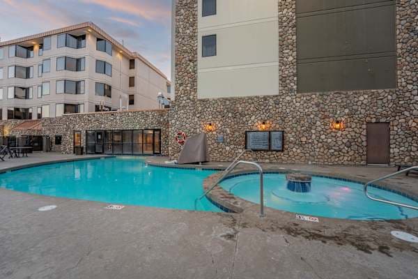 【Pool Deck】Hot tub steps from the heated pool — open year-round