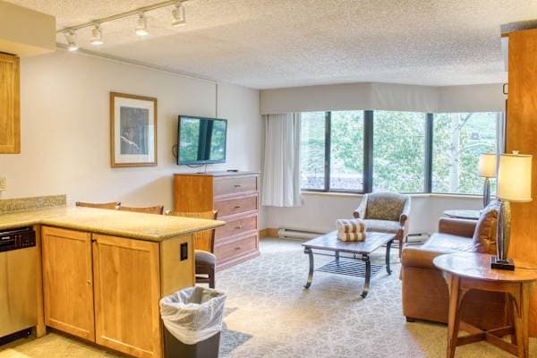 Larger Kitchen and Living Space with Murphy Bed. Room for the Family! Listed with @BookTraverse