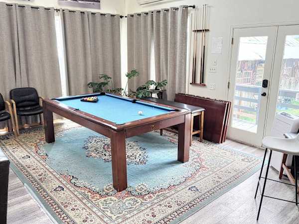 【Shared Great Room】Blue-felt table by the windows — rematch before dinner