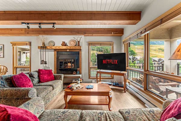 【Living Room + Fireplace】Wood-burning fireplace and a sectional built for the whole group
