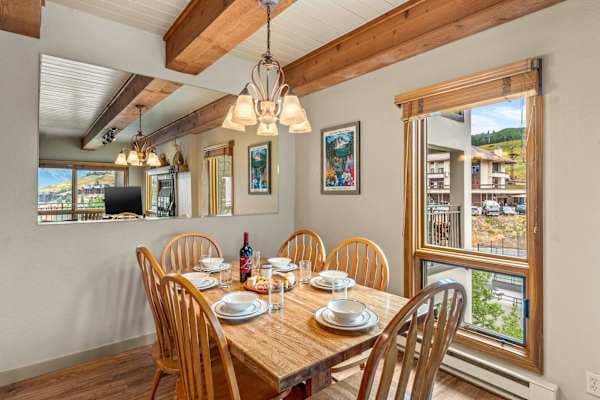 【Dining】Wood table seats 4 with pendant lights — family dinners in