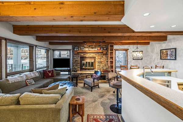 【Living Room — Alt Angle】Open sightline from sofa to kitchen and dining