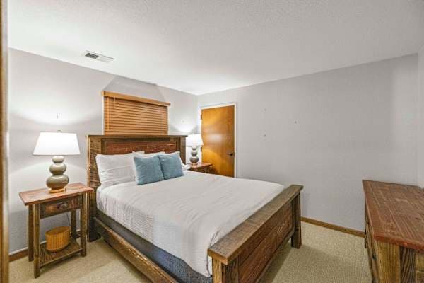 【Bedroom 2】Queen bed, second full bath steps away, morning light through the windows