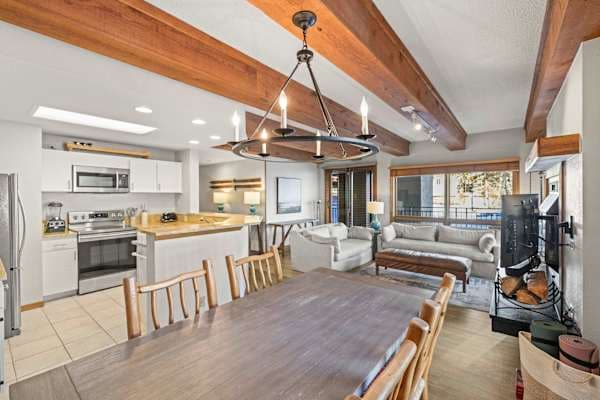 【Living Room】Open to the kitchen with the resort framed in the window behind you